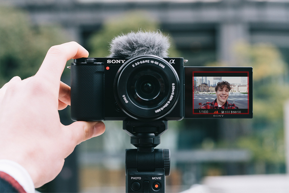 Taking a selfie using the product with the tilt screen open