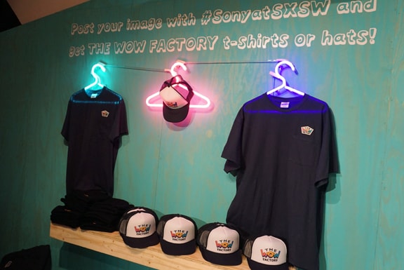 Photo of the T-shirts and caps for the WOW Factory staff