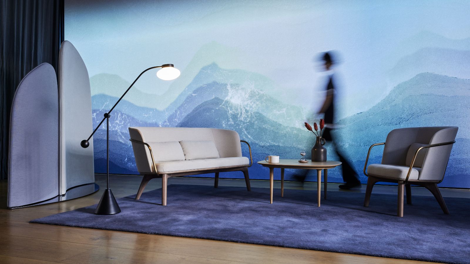 A walking person in a conceptual interior design composition with BYOBU partitions, iconic furniture in front of "BEYOND WALLPAPER"