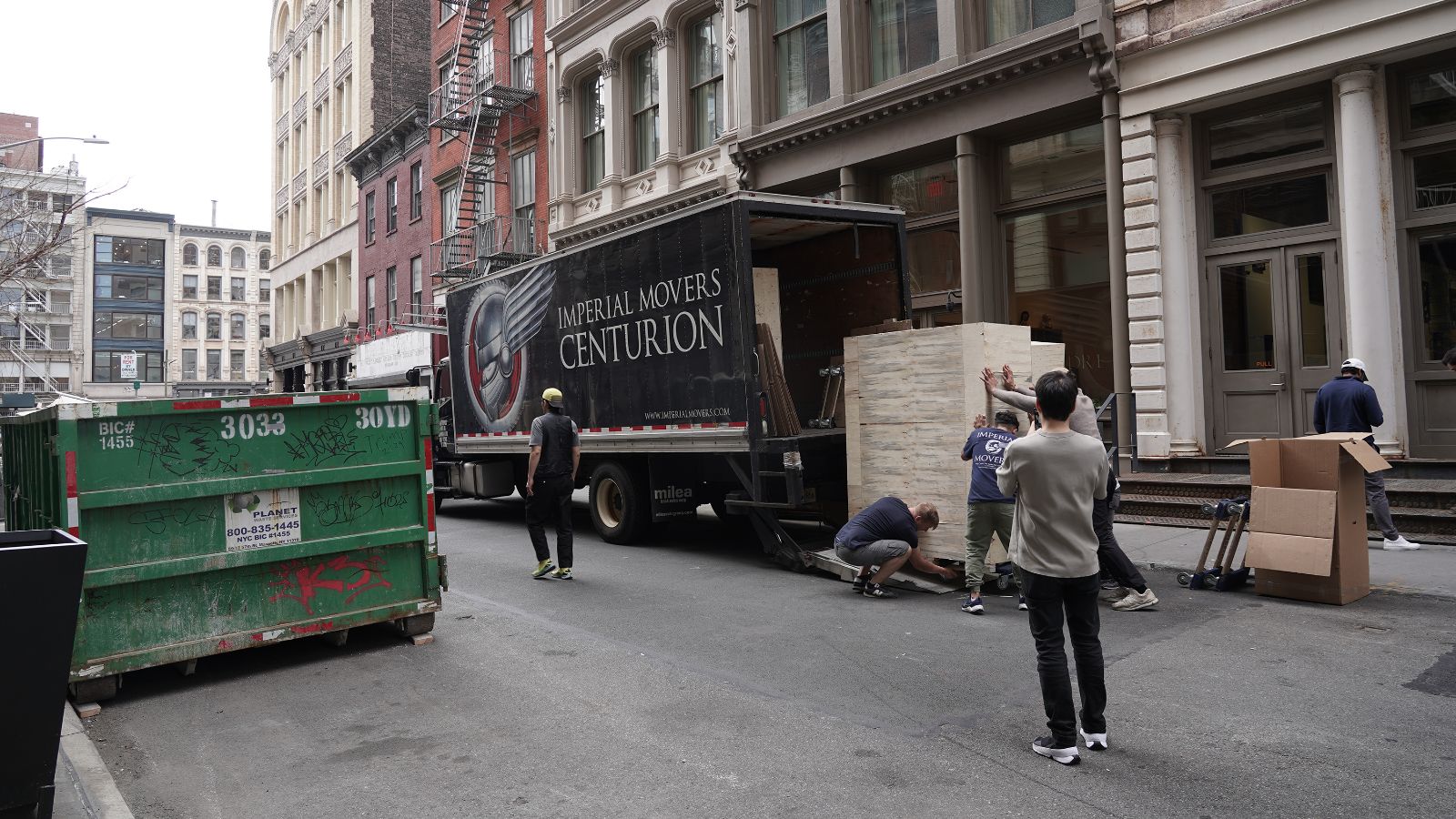 Prototypes being carried from a large trailer into the venue