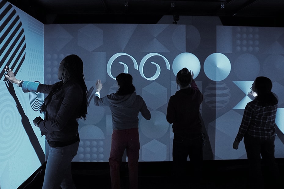 Photo of visitors enjoying the Warp Square with interactive content