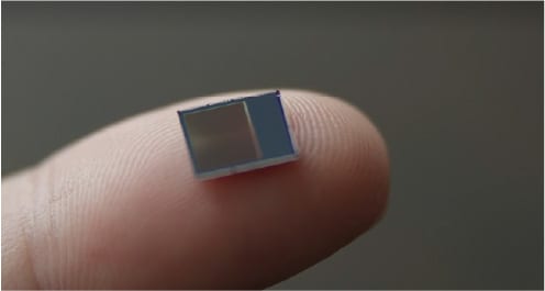 Image of an image sensor chip on a finger.