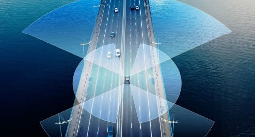 Image of a car driving on a bridge sensing its surroundings using in-vehicle sensing technology.