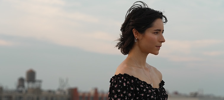 Image of a woman with a city background