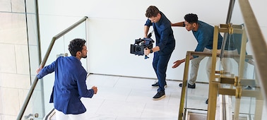 Image of a photographer shooting a man in a two-person setup.