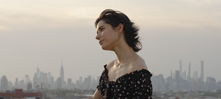 Image of a woman with a city background