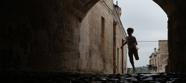 Example image showing a child running in a shaded tunnel