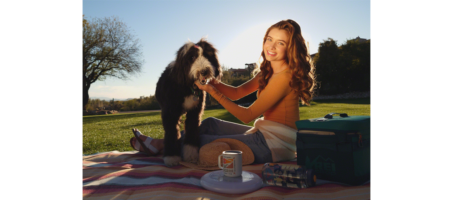 Image of father and daughter enjoying a barbecue by a river