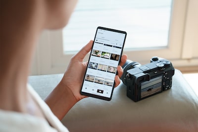 Photo of a woman looking at a photos transferred from the camera