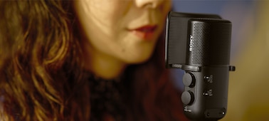 Usage image showing a woman singing with her mouth close to the microphone with pop guard attached