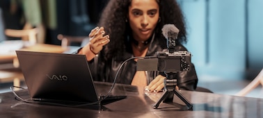 Usage image of a woman live streaming with the camera